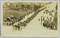Slim Moorhouse drawing 36 horses with 10 wagons of grain, Calgary Stampede.