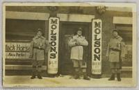 Men in front of bar