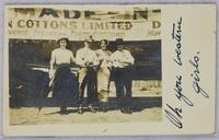 Four people standing in front of banner